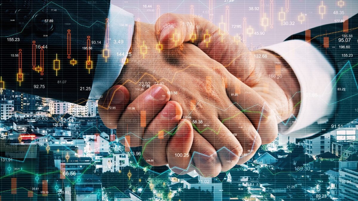 Gráficos financeiros e aperto de mãos simbolizando investimentos, negociações e comportamento do mercado imobiliário e financeiro. - Rocccoimob Imobiliária em Bombinhas